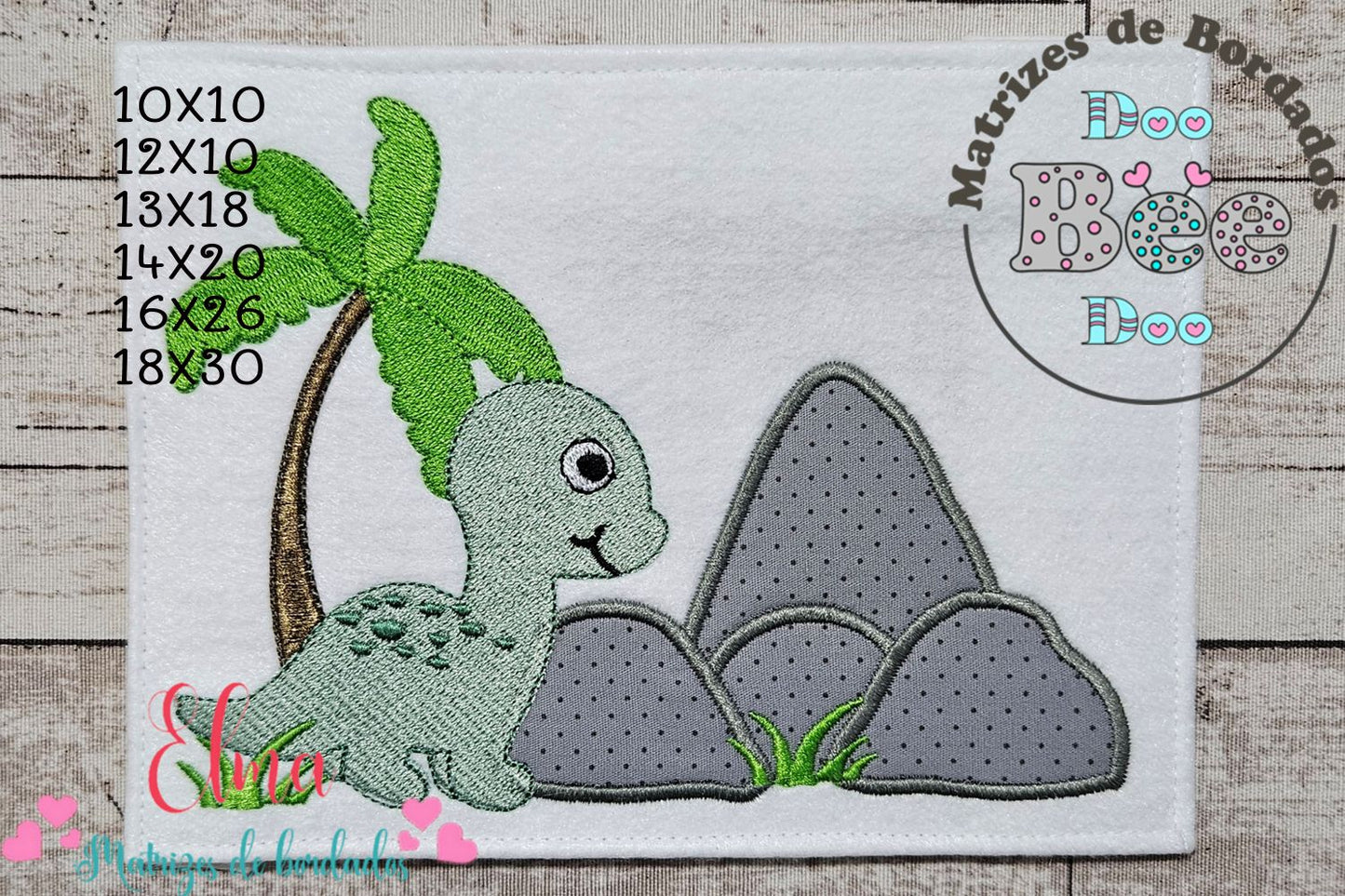 Matriz de Bordado Dinossauro com Palmeira e Rochas – Aplique